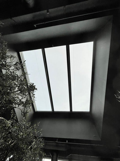 inside shot of a multipart rooflight in a dark room