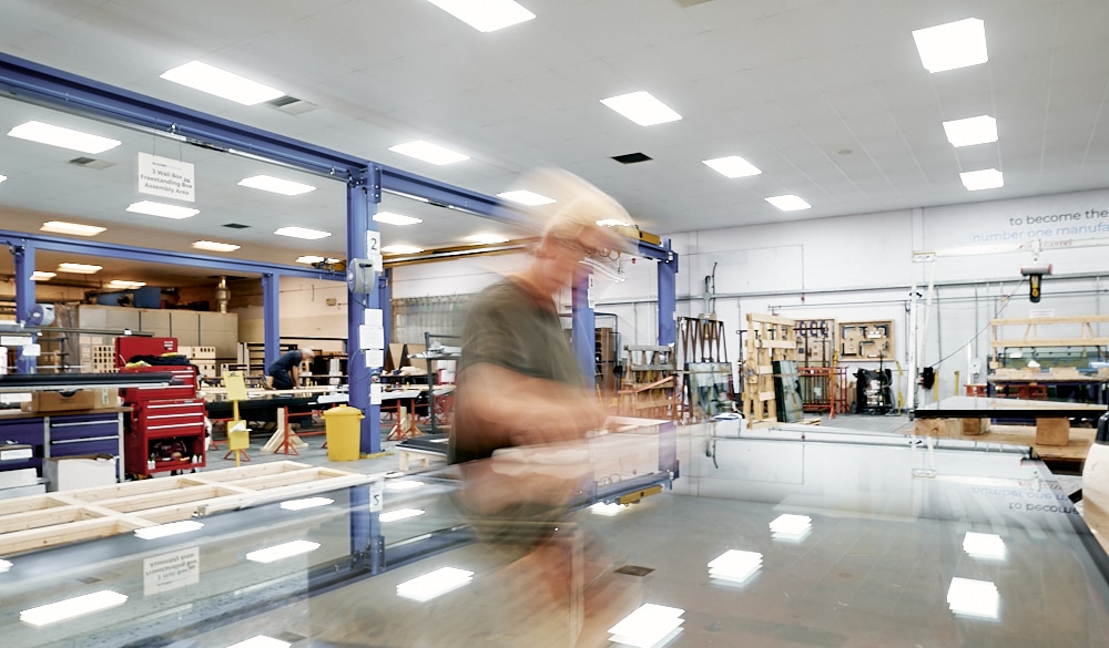 blurred person near a glass rooflight in a factory